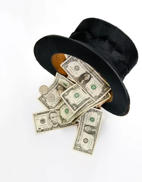 Top hat odrobina dolarów — Zdjęcie stockowe