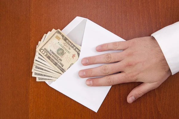 Corruption concept. Business man take a stack of money in envelo — Stock Photo, Image