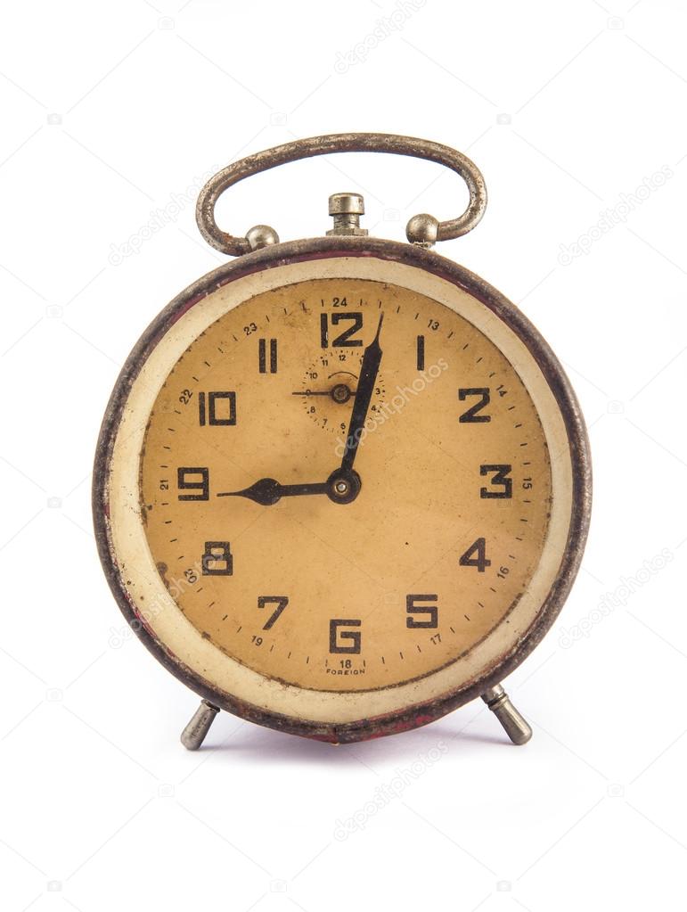 Very old retro alarm clock isolated on white background