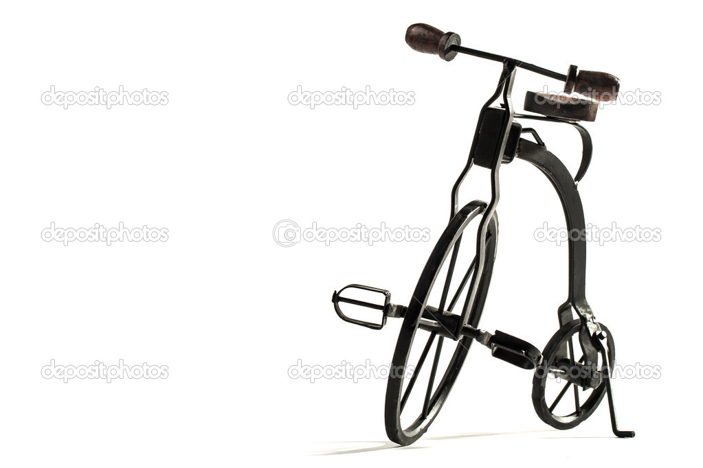 vintage toy velocipede isolated in white