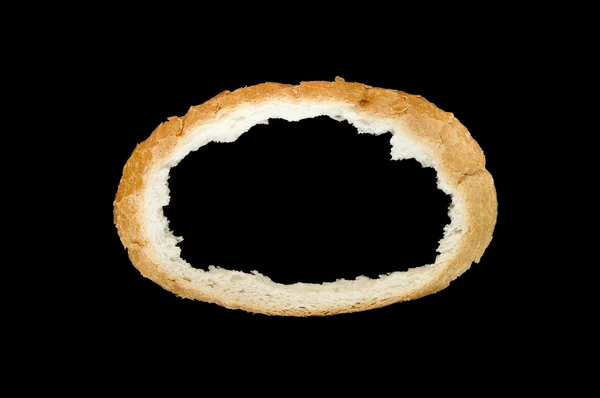 Slice of white bread without internal isolated on black — Stock Photo, Image