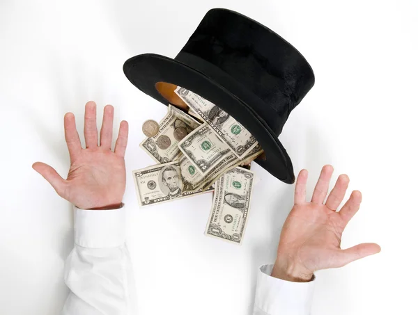 Businessman conjure a lot of dollars from an old black hat isola — Stock Photo, Image