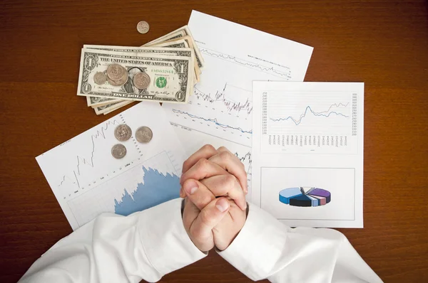 Financial crisis concept. Business man praying for money bills a — Stock Photo, Image