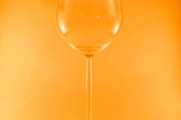 Wine glass isolated on orange background — Stock Photo, Image