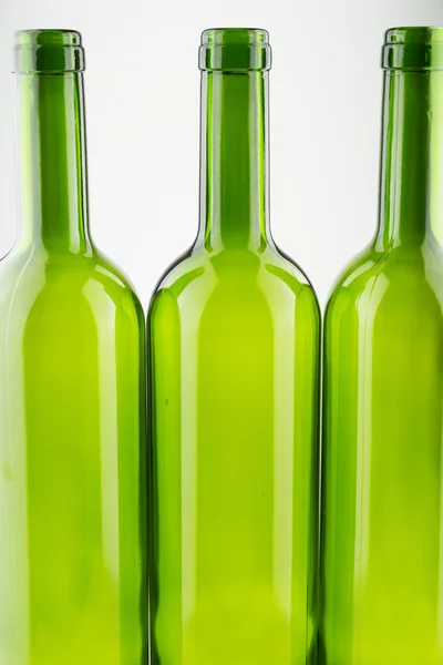 Empty green wine bottles isolated on white — Stock Photo, Image