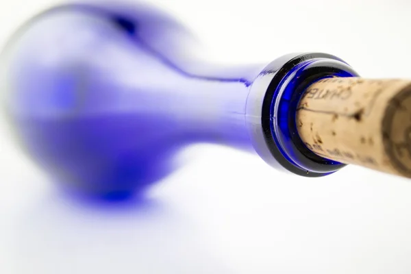Wine in blue bottle isolated on white background — Stock Photo, Image