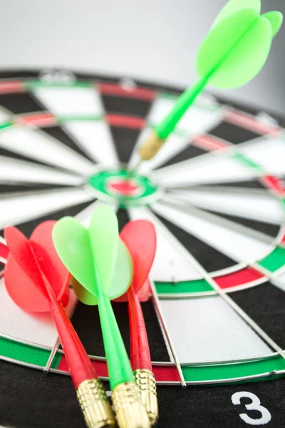 Colorful darts hitting a target, isolated on white — Stock Photo, Image