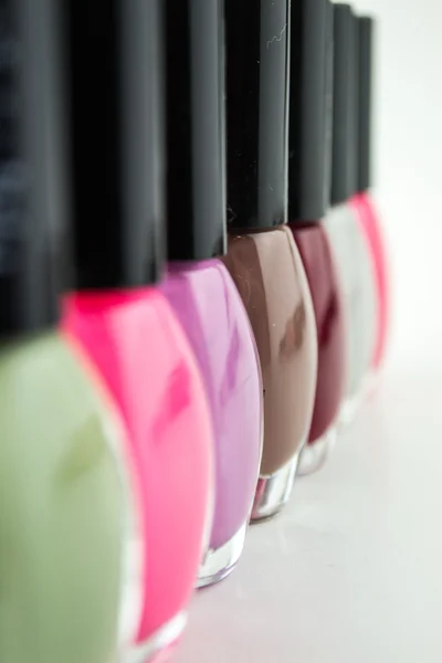 Group of bright nail polishes on white — Stock Photo, Image