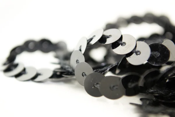 Black sequins pattern close up — Stock Photo, Image
