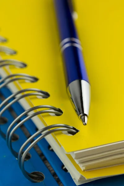 Spiral notebook and pen Stock Picture