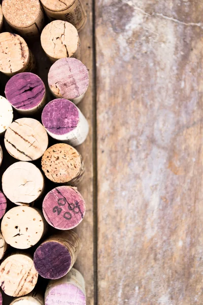 Bunch of wine corks on wooden table — Stock Photo, Image