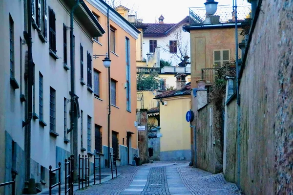 Rivoli. Turin. Italy. homes. roads. courtyards. window. door. lights and streetlights. winter. outdoor. people. walk. — Stock Photo, Image