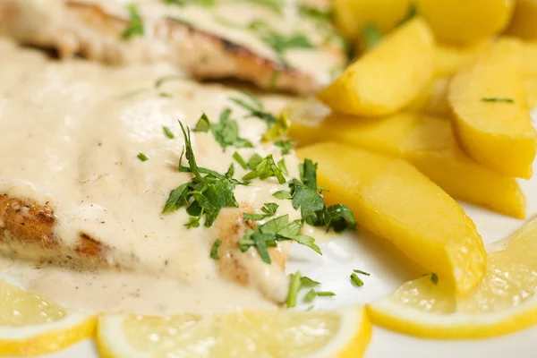Chicken steak with sause and potatoes — Stock Photo, Image