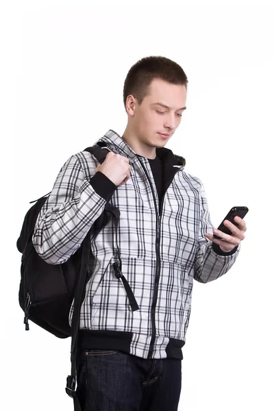Estudiante con mochila y teléfono celular —  Fotos de Stock