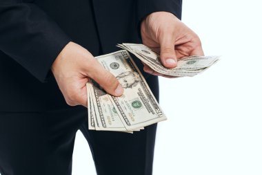 işadamı nakit dolar elinde tutan.