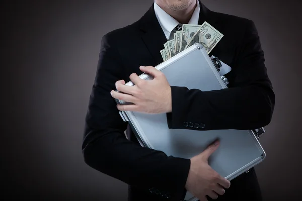 Homem de negócios com mala cheia de dinheiro — Fotografia de Stock
