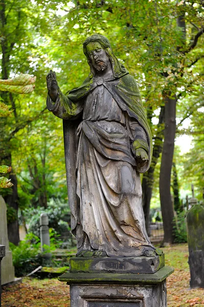 Sad angel statue on old cemetery