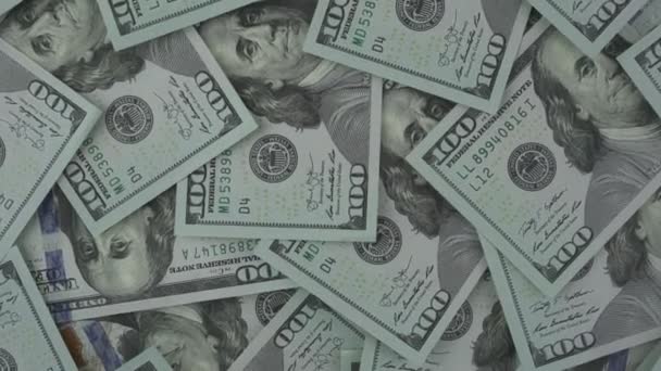 One hundred us dollars banknotes rotate in huge pile overhead view. — Stockvideo