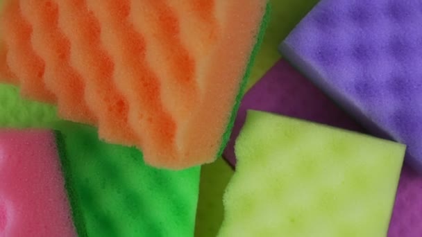 Kitchen cleaning multi colored set sponges and rag background — Stock Video