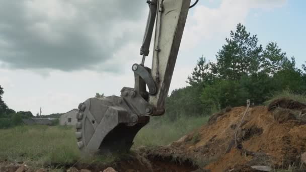 Operation mechanisms of excavator while digging ground with bucket — Video Stock