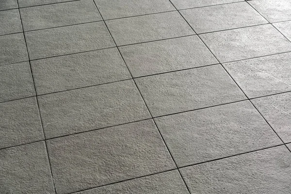 Gray colored tiled block floor at city pavement or garden area — Stock Photo, Image