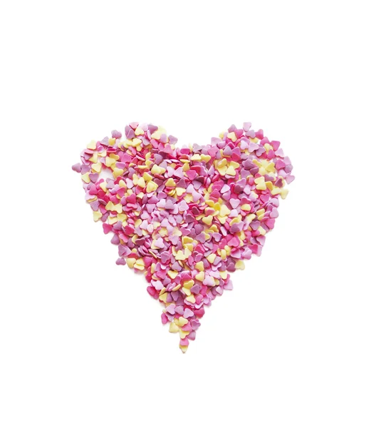 Pink heart made of candys on white background — Stock Photo, Image