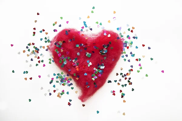 Corazón rojo con purpurina sobre fondo blanco —  Fotos de Stock