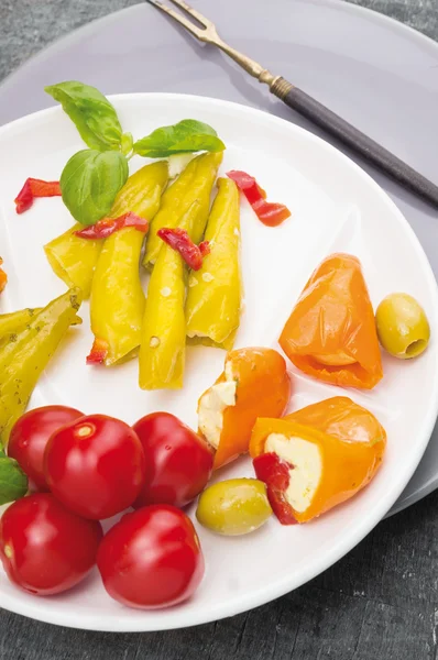 Colorful Antipasti vegetables , peppers with cream cheese , hot peppers , olives — Stock Photo, Image
