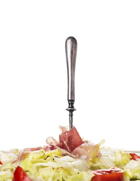 Serrano ham, Salad with tomatoes and fork, isolated — Stock Photo, Image