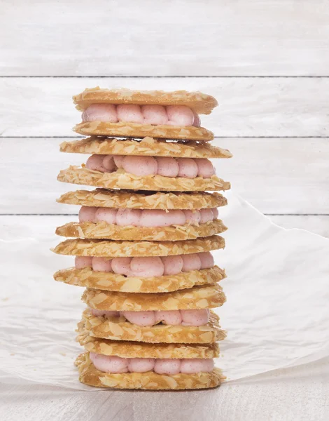 Heap of cookies with pink mousse — Stock Photo, Image