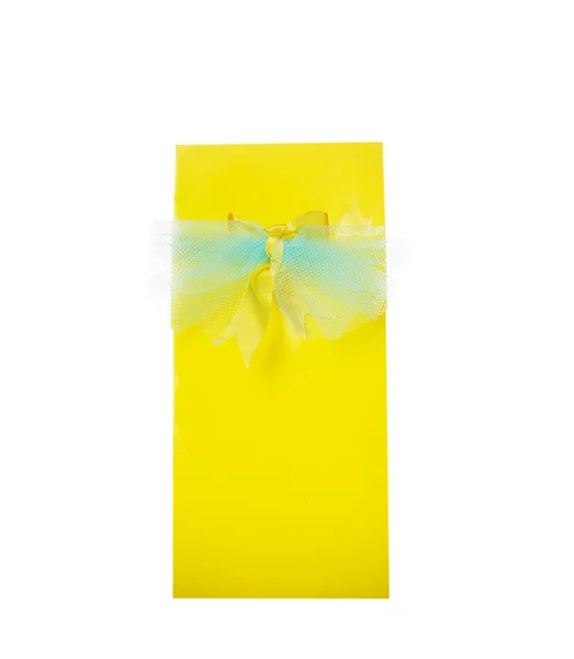 Yellow gift wrap , box of glossy paper with blue bow,isolated — Stock Photo, Image
