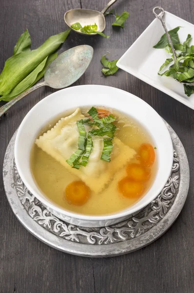 Soup with ravioli , carrots and ramson i — Stock Photo, Image