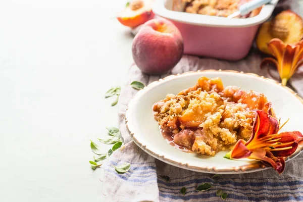 Close Delicious Peach Cobbler Dessert Plate Light Background Baking Pan — Foto Stock