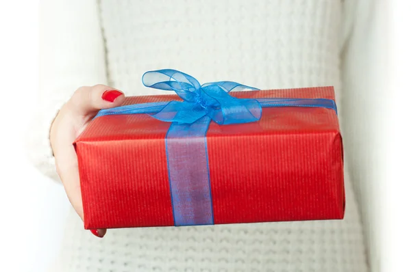 Hand and gift over white background — Stock Photo, Image
