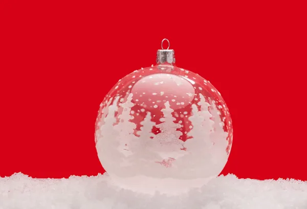 Christmas ball ornament in snow — Stock Photo, Image