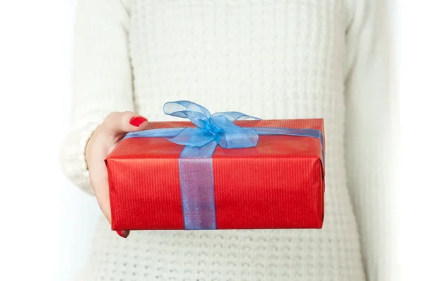 Hand and gift over white background — Stock Photo, Image