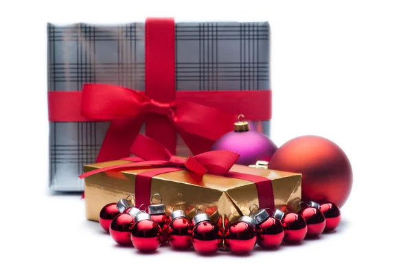 Christmas gifts, with balls. Isolated on white. — Stock Photo, Image