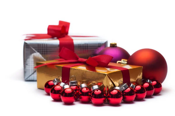 Christmas gifts, with balls. Isolated on white. — Stock Photo, Image