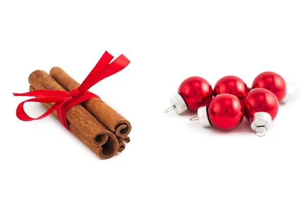 Cinnamon sticks and christmas ball Royalty Free Stock Images