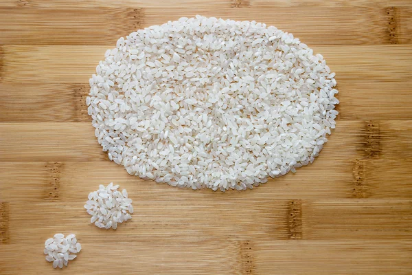 Rice on Bamboo background — Stock Photo, Image