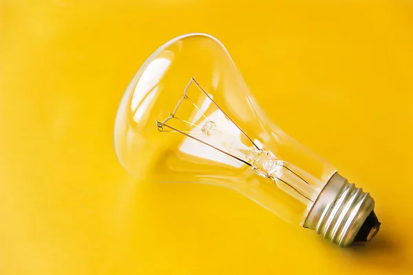Fundo amarelo da lâmpada — Fotografia de Stock