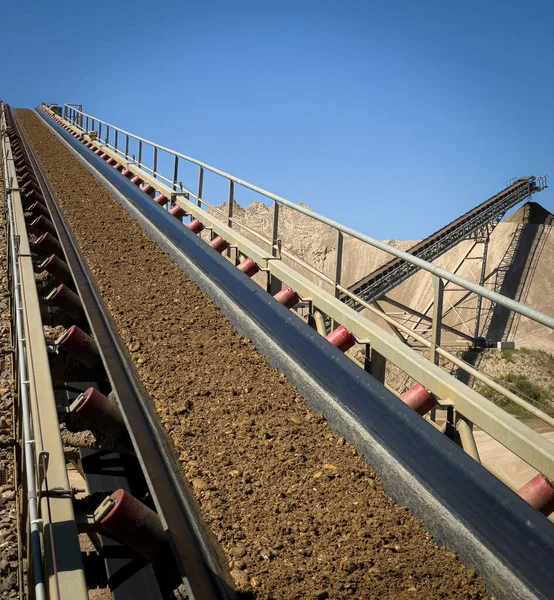 conveyor belts pouring sand in a quarry