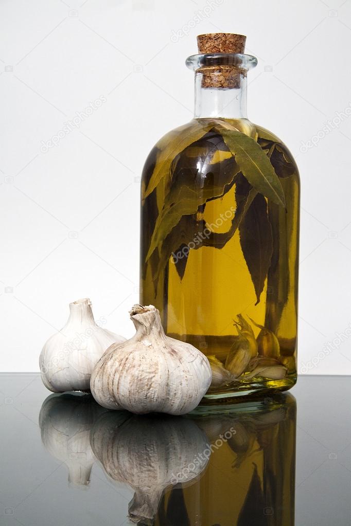 Garlics an olive oil bottle