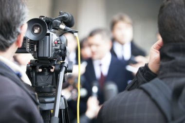 covering an event with a video camera clipart