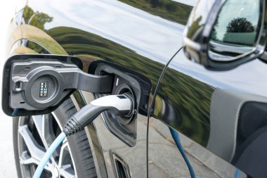 Charging battery of an electric car at charge station