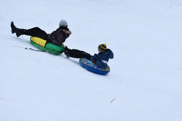 Happy Kids Tubing Snow Slide Winter Cheerful Childrens Active Sports — Stockfoto