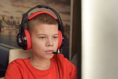 boy is playing an online game on the internet. children's gambling addiction. online learning