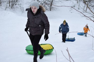 cheerful children on winter holidays. children on the snow slides