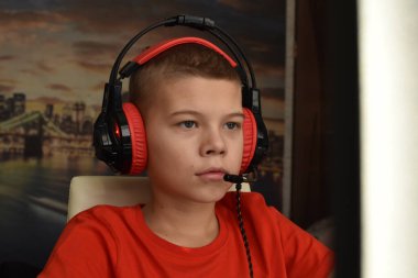 boy is playing an online game on the internet. children's gambling addiction. online learning