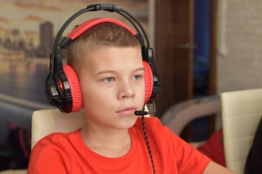 boy is playing an online game on the internet. children's gambling addiction. online learning